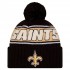 New Orleans Saints New Era Black 2024 Sideline Cuffed Knit Hat with Pom