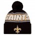 New Orleans Saints New Era Black 2024 Sideline Sport Cuffed Knit Hat with Pom
