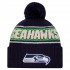Seattle Seahawks New Era College Navy 2024 Sideline Cuffed Knit Hat with Pom